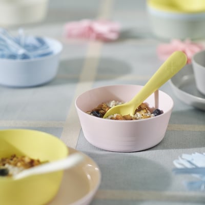 KALAS bowls in pink and pastel colours, made of durable plastic, round shape with a yellow spoon, small size, perfect for kids.